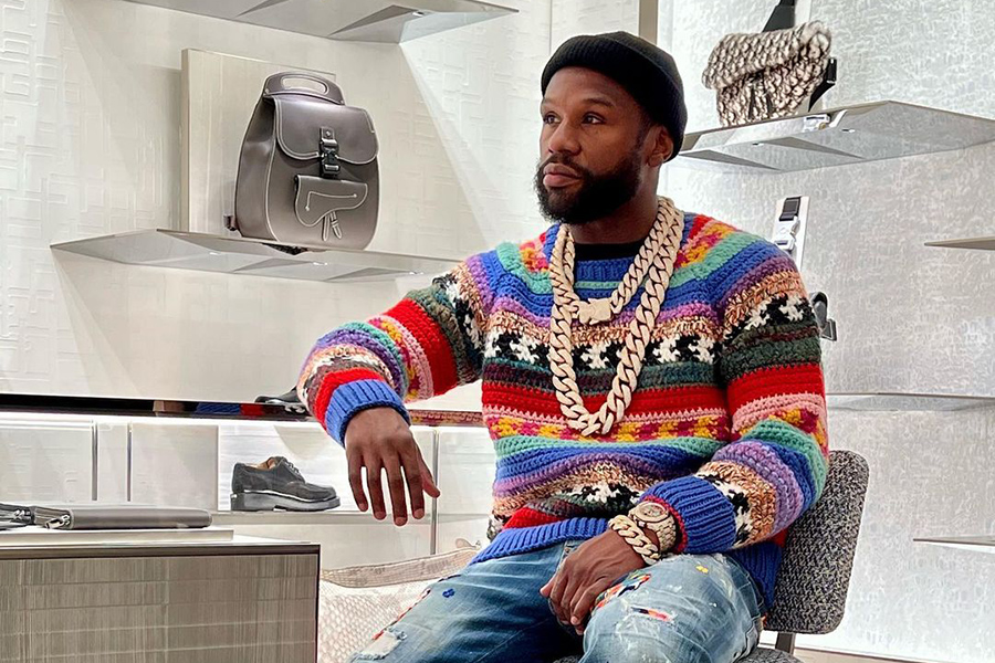 Floyd 'Money' Mayweather is surrounded by special forces guards after 'spending $7m at Gucci' in South Africa